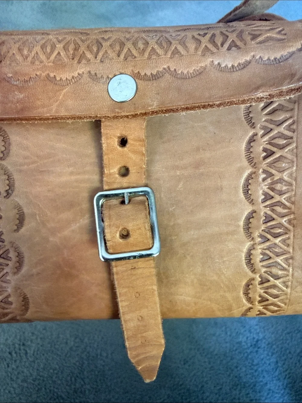 Vintage Tooled Leather Crossbody Bag with Buckle Front.